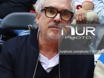 Mexican director Alfonso Cuaron is being seen during the game of the National Professional Basketball League (LNBP) between Diablos Rojos an...