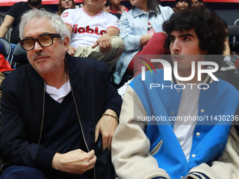 Mexican director Alfonso Cuaron is being seen during the game of the National Professional Basketball League (LNBP) between Diablos Rojos an...