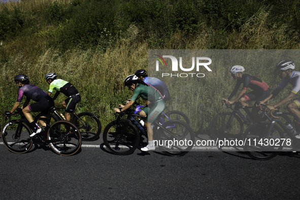 Members of the Mexican triathlon team are cycling during their training for the Paris Olympic Games in Lugo, Galicia, Spain, on July 23, 202...