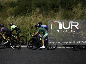 Members of the Mexican triathlon team are cycling during their training for the Paris Olympic Games in Lugo, Galicia, Spain, on July 23, 202...