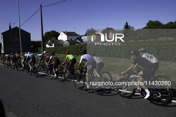 Members of the Mexican triathlon team are cycling during their training for the Paris Olympic Games in Lugo, Galicia, Spain, on July 23, 202...