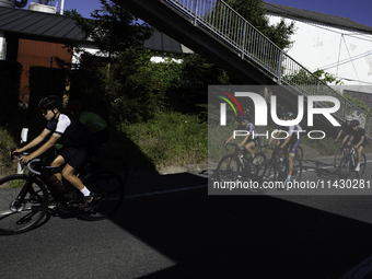 Members of the Mexican triathlon team are cycling during their training for the Paris Olympic Games in Lugo, Galicia, Spain, on July 23, 202...