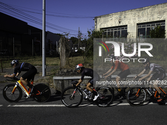 Members of the Mexican triathlon team are cycling during their training for the Paris Olympic Games in Lugo, Galicia, Spain, on July 23, 202...