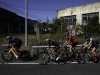 Members of the Mexican triathlon team are cycling during their training for the Paris Olympic Games in Lugo, Galicia, Spain, on July 23, 202...