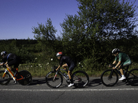 Members of the Mexican triathlon team are cycling during their training for the Paris Olympic Games in Lugo, Galicia, Spain, on July 23, 202...