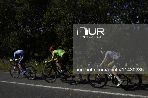 Members of the Mexican triathlon team are cycling during their training for the Paris Olympic Games in Lugo, Galicia, Spain, on July 23, 202...