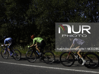 Members of the Mexican triathlon team are cycling during their training for the Paris Olympic Games in Lugo, Galicia, Spain, on July 23, 202...