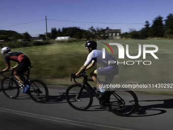 Members of the Mexican triathlon team are cycling during their training for the Paris Olympic Games in Lugo, Galicia, Spain, on July 23, 202...