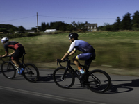 Members of the Mexican triathlon team are cycling during their training for the Paris Olympic Games in Lugo, Galicia, Spain, on July 23, 202...