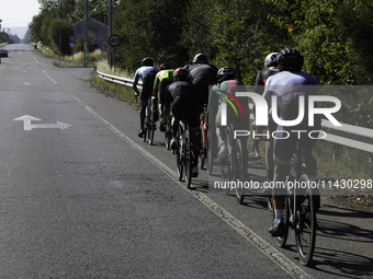 Members of the Mexican triathlon team are cycling during their training for the Paris Olympic Games in Lugo, Galicia, Spain, on July 23, 202...