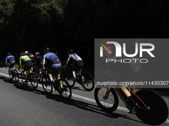 Members of the Mexican triathlon team are cycling during their training for the Paris Olympic Games in Lugo, Galicia, Spain, on July 23, 202...