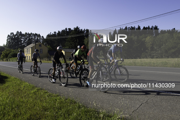 Members of the Mexican triathlon team are cycling during their training for the Paris Olympic Games in Lugo, Galicia, Spain, on July 23, 202...