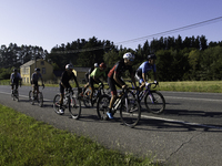 Members of the Mexican triathlon team are cycling during their training for the Paris Olympic Games in Lugo, Galicia, Spain, on July 23, 202...