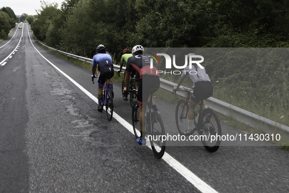 Members of the Mexican triathlon team are cycling during their training for the Paris Olympic Games in Lugo, Galicia, Spain, on July 23, 202...