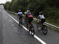 Members of the Mexican triathlon team are cycling during their training for the Paris Olympic Games in Lugo, Galicia, Spain, on July 23, 202...