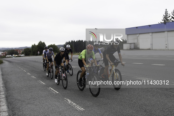 Members of the Mexican triathlon team are cycling during their training for the Paris Olympic Games in Lugo, Galicia, Spain, on July 23, 202...