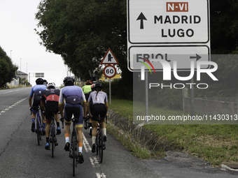 Members of the Mexican triathlon team are cycling during their training for the Paris Olympic Games in Lugo, Galicia, Spain, on July 23, 202...