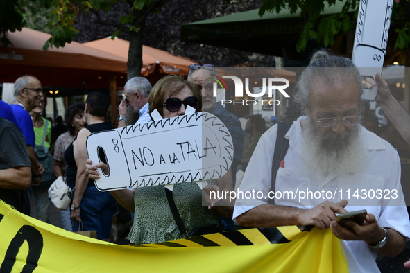 Madrid residents are demonstrating against the City Council's decision to cut down the trees in Plaza de Santa Ana to expand an underground...