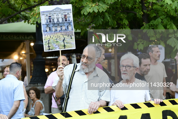 Madrid residents are demonstrating against the City Council's decision to cut down the trees in Plaza de Santa Ana to expand an underground...