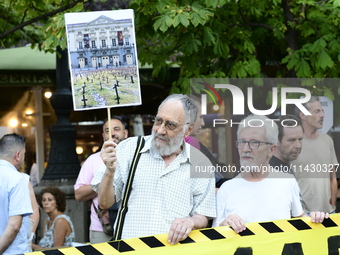 Madrid residents are demonstrating against the City Council's decision to cut down the trees in Plaza de Santa Ana to expand an underground...