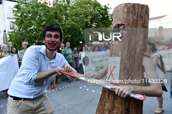 Madrid residents are demonstrating against the City Council's decision to cut down the trees in Plaza de Santa Ana to expand an underground...