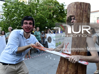 Madrid residents are demonstrating against the City Council's decision to cut down the trees in Plaza de Santa Ana to expand an underground...