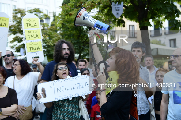 Madrid residents are demonstrating against the City Council's decision to cut down the trees in Plaza de Santa Ana to expand an underground...