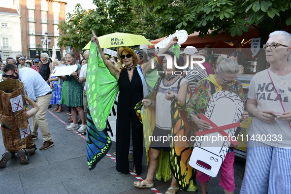 Madrid residents are demonstrating against the City Council's decision to cut down the trees in Plaza de Santa Ana to expand an underground...