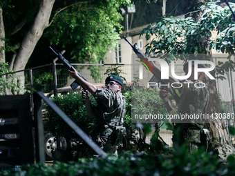 Soldiers of a military detachment are firing shots during the ceremony in Limassol, Cyprus, on July 22, 2024. The AHEPA (American Hellenic E...