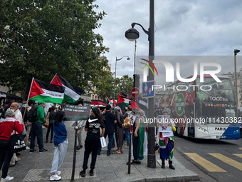 A demonstration is taking place in support of Palestine to stop the genocide of Palestinians and to exclude Israel from the Paris Olympics a...