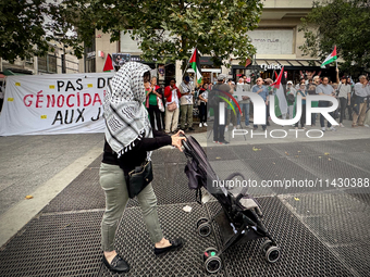 A demonstration is taking place in support of Palestine to stop the genocide of Palestinians and to exclude Israel from the Paris Olympics a...