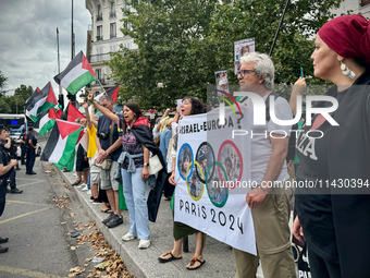 A demonstration is taking place in support of Palestine to stop the genocide of Palestinians and to exclude Israel from the Paris Olympics a...