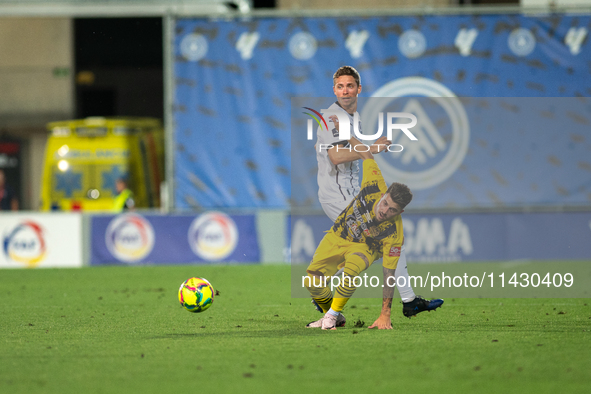 Players are in action during the second phase of the UEFA Champions League Qualification 2024-2025 match between UD Santa Coloma and FC Midt...