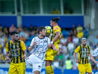 Players are in action during the second phase of the UEFA Champions League Qualification 2024-2025 match between UD Santa Coloma and FC Midt...