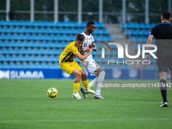 Players are in action during the second phase of the UEFA Champions League Qualification 2024-2025 match between UD Santa Coloma and FC Midt...