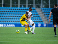 Players are in action during the second phase of the UEFA Champions League Qualification 2024-2025 match between UD Santa Coloma and FC Midt...