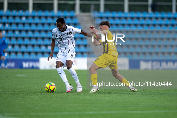 Players are in action during the second phase of the UEFA Champions League Qualification 2024-2025 match between UD Santa Coloma and FC Midt...