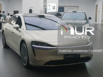 The Stelato 9, a smart luxury electric car, is being pictured at a Huawei store in Hangzhou, China, on July 24, 2024. (