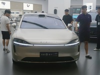 Customers are experiencing the Stelato 9, a smart luxury pure electric car, at a Huawei store in Hangzhou, China, on July 24, 2024. (