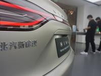 Customers are experiencing the Stelato 9, a smart luxury pure electric car, at a Huawei store in Hangzhou, China, on July 24, 2024. (