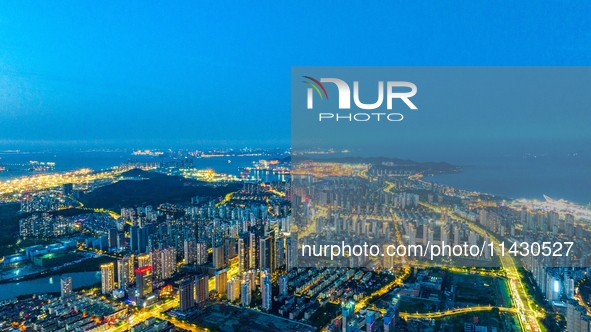 The West Coast New Area, a state-level new area, is shining brightly in Qingdao, China, on July 23, 2024. With the 34th Qingdao Internationa...