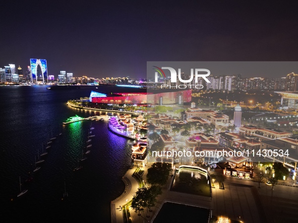 A photo is showing the night view of Moonlight Pier, a business district in Suzhou, Jiangsu province, China, on May 29, 2024. 