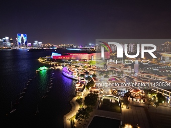 A photo is showing the night view of Moonlight Pier, a business district in Suzhou, Jiangsu province, China, on May 29, 2024. (