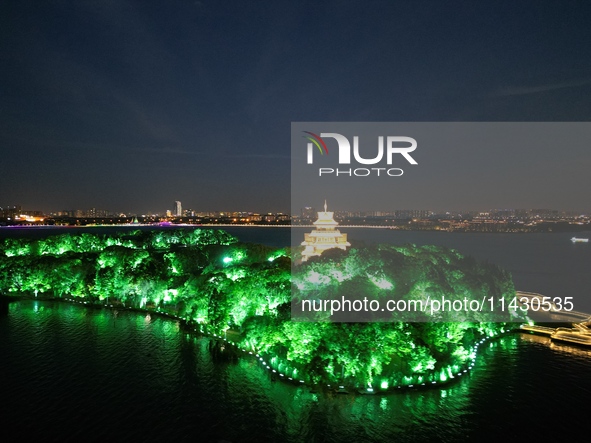 A photo is showing the night view of Moonlight Pier, a business district in Suzhou, Jiangsu province, China, on May 29, 2024. 