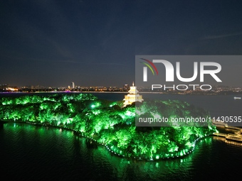 A photo is showing the night view of Moonlight Pier, a business district in Suzhou, Jiangsu province, China, on May 29, 2024. (