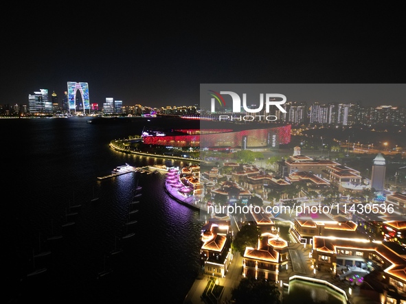 A photo is showing the night view of Moonlight Pier, a business district in Suzhou, Jiangsu province, China, on May 29, 2024. 