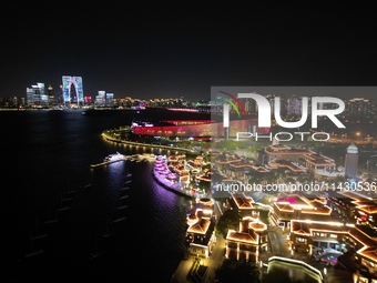 A photo is showing the night view of Moonlight Pier, a business district in Suzhou, Jiangsu province, China, on May 29, 2024. (