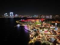 A photo is showing the night view of Moonlight Pier, a business district in Suzhou, Jiangsu province, China, on May 29, 2024. (