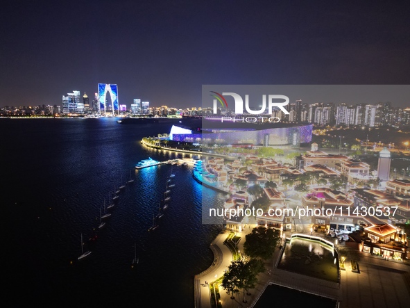 A photo is showing the night view of Moonlight Pier, a business district in Suzhou, Jiangsu province, China, on May 29, 2024. 