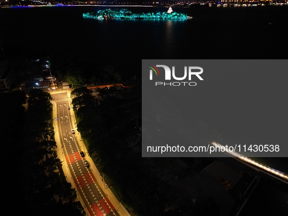 A photo is showing the night view of Moonlight Pier, a business district in Suzhou, Jiangsu province, China, on May 29, 2024. 